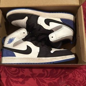 Preowned blue and white and black Air Jordan Size 2Y not in original box